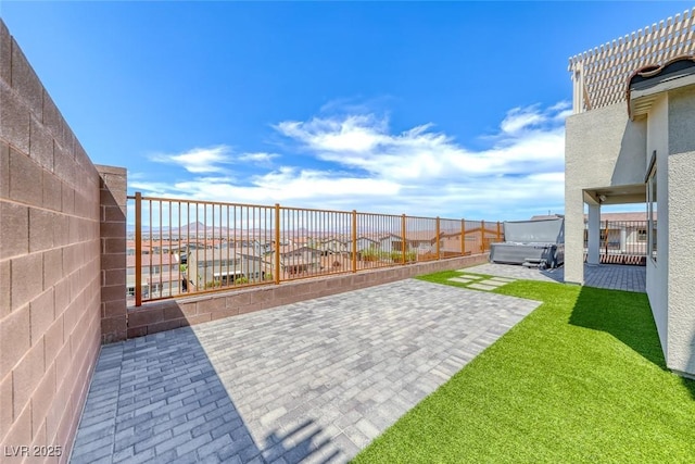 1038 Delbrook Ave, Henderson, NV 89012 - fenced backyard with a patio and a hot tub