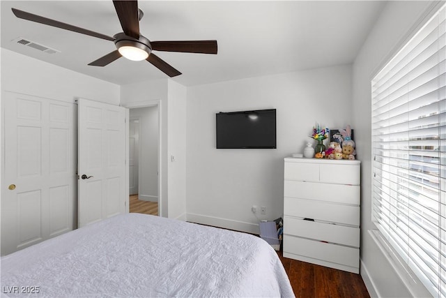 2250 Bowie Cir, Henderson, NV 89014 - bedroom featuring dark wood finished floors, baseboards, and ceiling fan