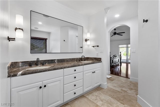2250 Bowie Cir, Henderson, NV 89014 - bathroom with double vanity, ceiling fan, and baseboards