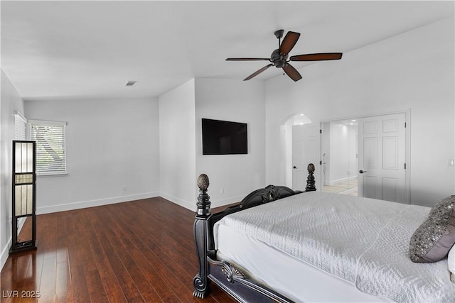 2250 Bowie Cir, Henderson, NV 89014 - bedroom with baseboards, arched walkways, wood finished floors, and a ceiling fan