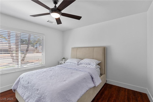 2250 Bowie Cir, Henderson, NV 89014 - bedroom with baseboards, wood finished floors, and a ceiling fan