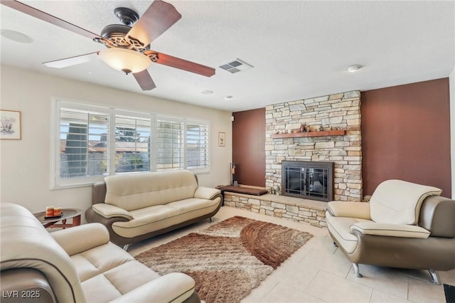 1912 Parkchester Dr, Las Vegas, NV 89108 - tiled living area with ceiling fan and a fireplace