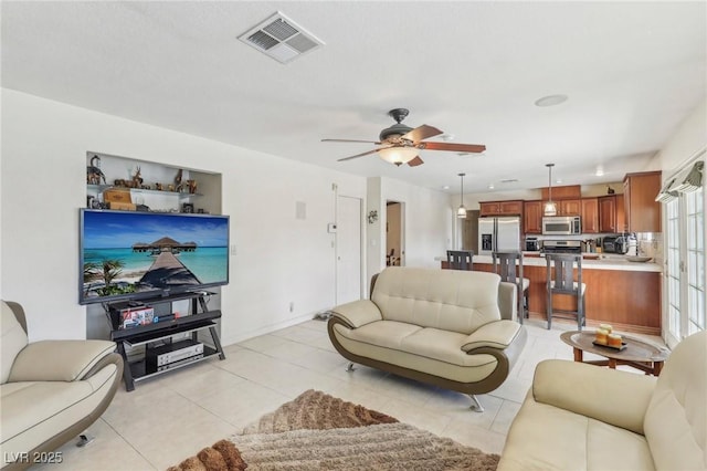1912 Parkchester Dr, Las Vegas, NV 89108 - living room with a ceiling fan and light tile patterned floors