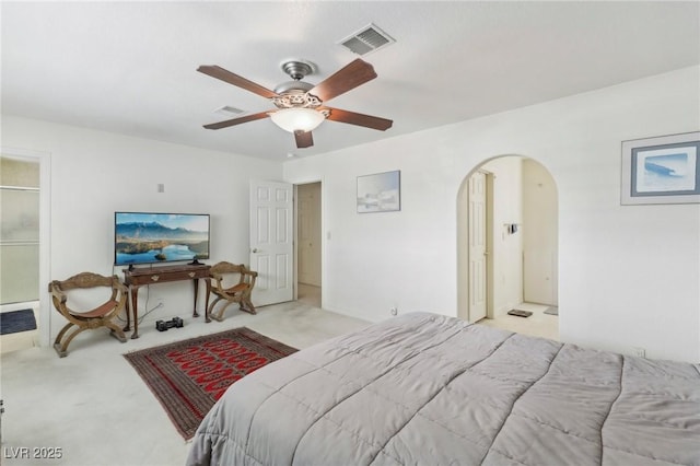 1912 Parkchester Dr, Las Vegas, NV 89108 - bedroom featuring arched walkways, light carpet, and a ceiling fan