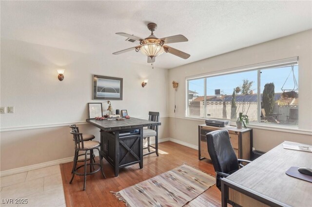 1912 Parkchester Dr, Las Vegas, NV 89108 - office area with a ceiling fan, baseboards, and wood finished floors