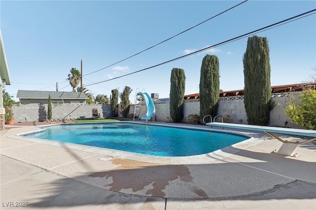 1912 Parkchester Dr, Las Vegas, NV 89108 - view of swimming pool featuring a water slide, a fenced backyard, and a patio