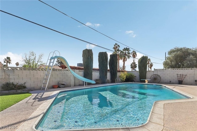 1912 Parkchester Dr, Las Vegas, NV 89108 - view of pool featuring a water slide, a fenced backyard, and a patio area