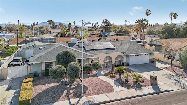 1912 Parkchester Dr, Las Vegas, NV 89108 - ranch-style home featuring a gate, an attached garage, concrete driveway, stucco siding, and a shingled roof