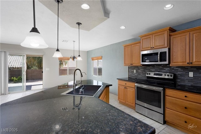 854 Santa Maria Way, Mesquite, NV 89027 - kitchen with stainless steel appliances, a sink, backsplash, light tile patterned flooring, and recessed lighting