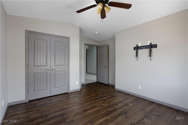 854 Santa Maria Way, Mesquite, NV 89027 - unfurnished bedroom featuring dark wood-type flooring, lofted ceiling, baseboards, a closet, and a ceiling fan
