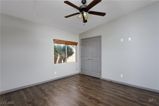 854 Santa Maria Way, Mesquite, NV 89027 - unfurnished bedroom with dark wood-style floors, baseboards, vaulted ceiling, a ceiling fan, and a closet