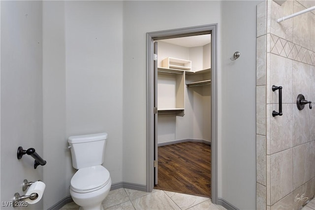 854 Santa Maria Way, Mesquite, NV 89027 - full bath featuring toilet, a tile shower, a spacious closet, and baseboards