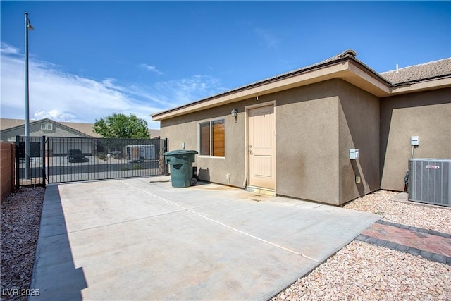 854 Santa Maria Way, Mesquite, NV 89027 - back of house with central AC, stucco siding, a gate, and a patio area