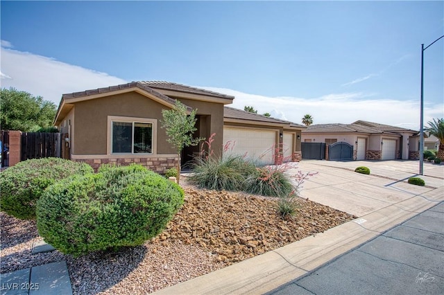 854 Santa Maria Way, Mesquite, NV 89027 - ranch-style home featuring stucco siding, driveway, an attached garage, and stone siding