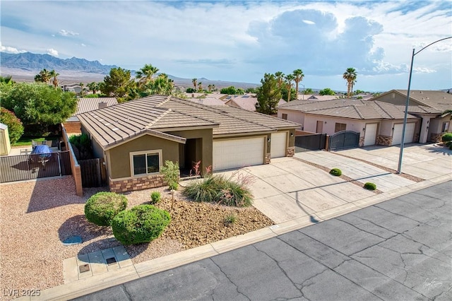 854 Santa Maria Way, Mesquite, NV 89027 - single story home featuring a gate, stucco siding, concrete driveway, an attached garage, and a tile roof
