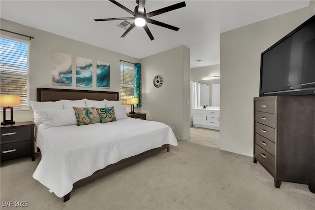 2558 Wiltshire Ave, Henderson, NV 89052 - bedroom with light carpet, ensuite bathroom, and ceiling fan