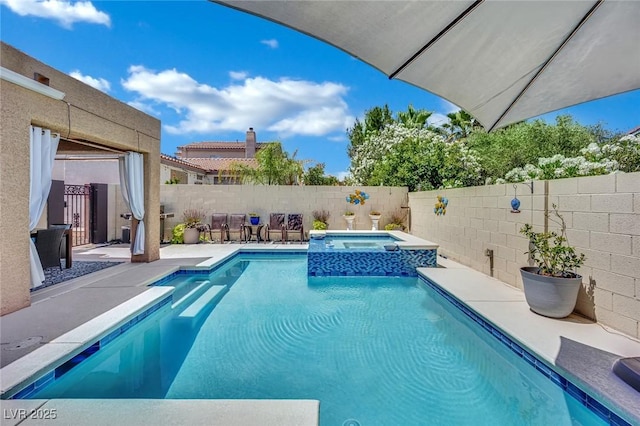 2558 Wiltshire Ave, Henderson, NV 89052 - view of pool featuring a fenced backyard, a pool with connected hot tub, and a patio area