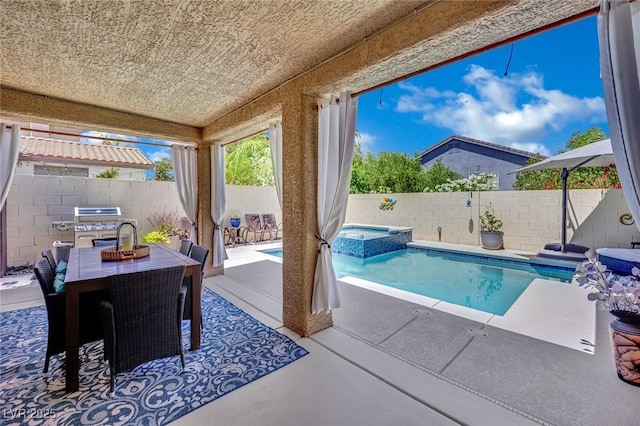 2558 Wiltshire Ave, Henderson, NV 89052 - view of swimming pool with a patio area, outdoor dining space, a fenced backyard, and a pool with connected hot tub