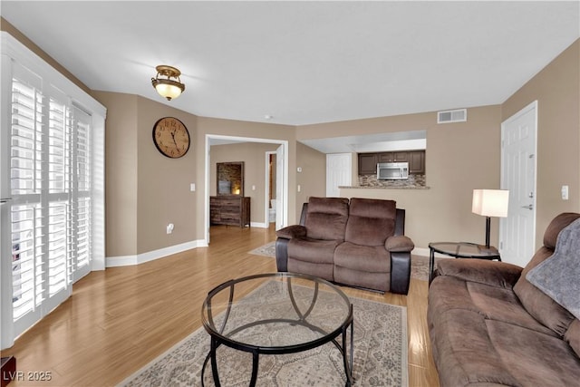 6800 E Lake Mead Blvd Unit 2089, Las Vegas, NV 89156 - living room featuring light wood-style flooring and baseboards