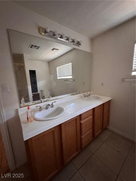 2604 Webster St, North Las Vegas, NV 89030 - full bathroom with tile patterned flooring and double vanity