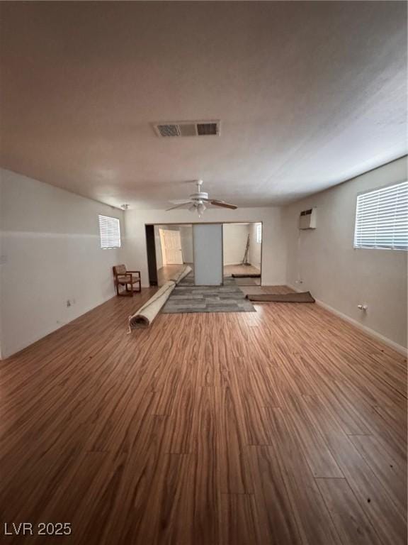 2604 Webster St, North Las Vegas, NV 89030 - unfurnished living room with wood finished floors and ceiling fan