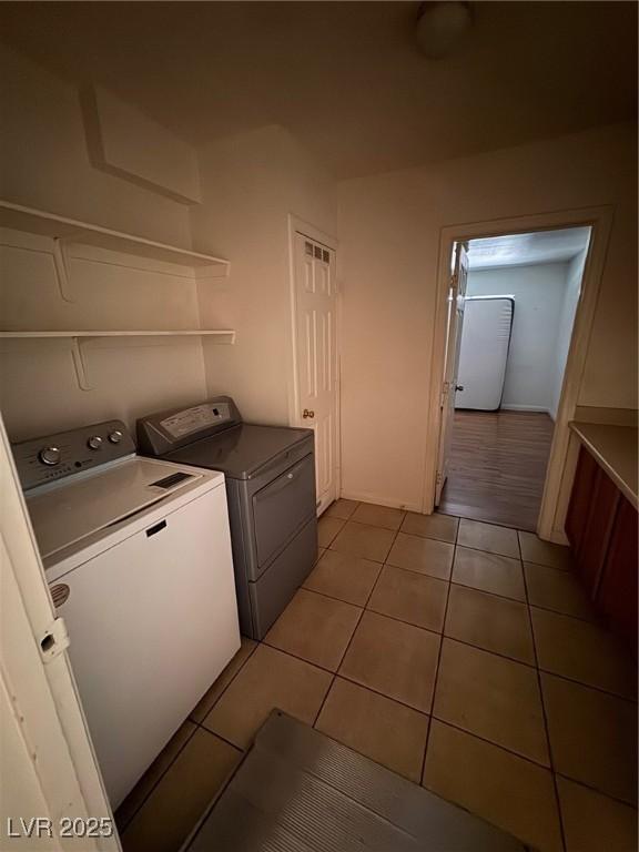 2604 Webster St, North Las Vegas, NV 89030 - laundry room featuring separate washer and dryer and light tile patterned flooring