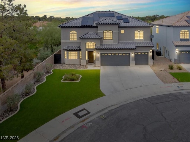3204 Rutledge Dr, Las Vegas, NV 89120 - mediterranean / spanish-style house featuring an attached garage, stucco siding, solar panels, a tile roof, and concrete driveway