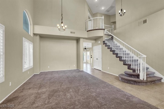 3204 Rutledge Dr, Las Vegas, NV 89120 - carpeted entrance foyer with a chandelier, a towering ceiling, stairway, baseboards, and a ceiling fan