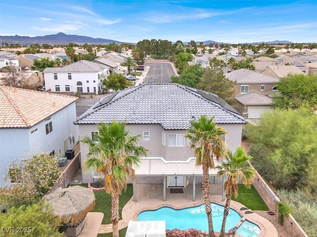 3204 Rutledge Dr, Las Vegas, NV 89120 - aerial perspective of suburban area featuring a pool and mountains