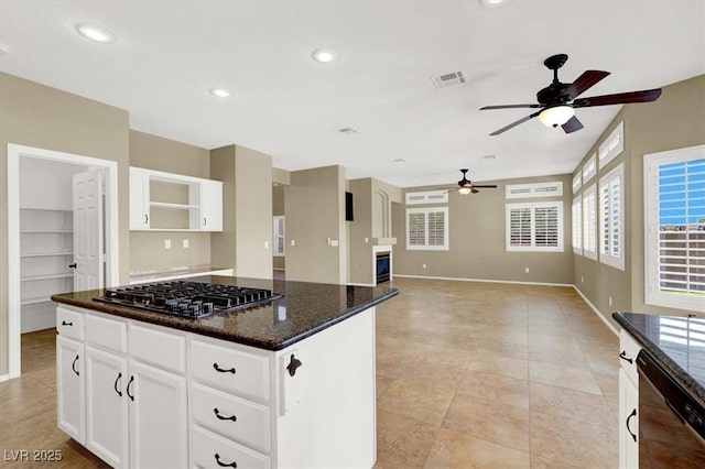 3204 Rutledge Dr, Las Vegas, NV 89120 - kitchen with dishwasher, ceiling fan, a center island, baseboards, and gas cooktop