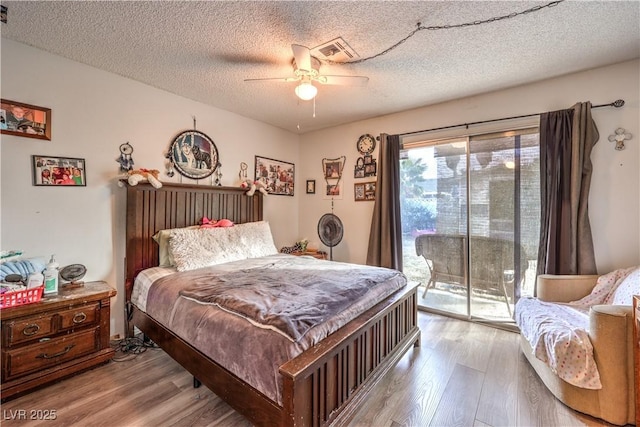 5809 Robin Ln, Las Vegas, NV 89108 - bedroom with access to exterior, light wood-type flooring, a textured ceiling, and ceiling fan
