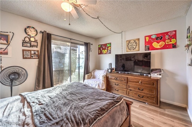 5809 Robin Ln, Las Vegas, NV 89108 - bedroom with light wood-type flooring, a textured ceiling, baseboards, and ceiling fan