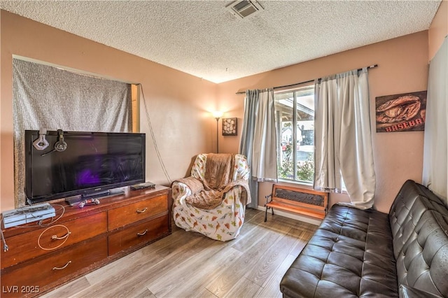5809 Robin Ln, Las Vegas, NV 89108 - living area with wood finished floors and a textured ceiling