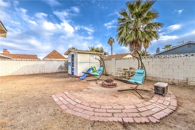 5809 Robin Ln, Las Vegas, NV 89108 - fenced backyard with a fire pit
