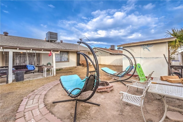 5809 Robin Ln, Las Vegas, NV 89108 - view of yard with a patio, a fire pit, and cooling unit