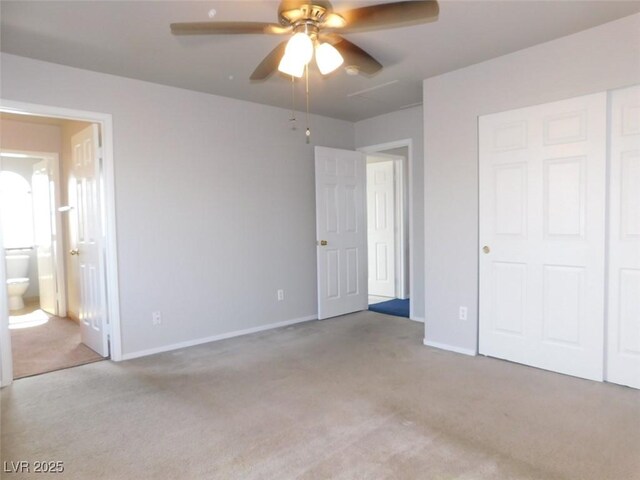 2905 Shimmering Bay St, Laughlin, NV 89029 - unfurnished bedroom with light colored carpet, connected bathroom, and baseboards