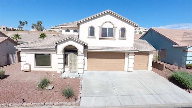 2905 Shimmering Bay St, Laughlin, NV 89029 - mediterranean / spanish-style home featuring stucco siding, a garage, driveway, and a tile roof