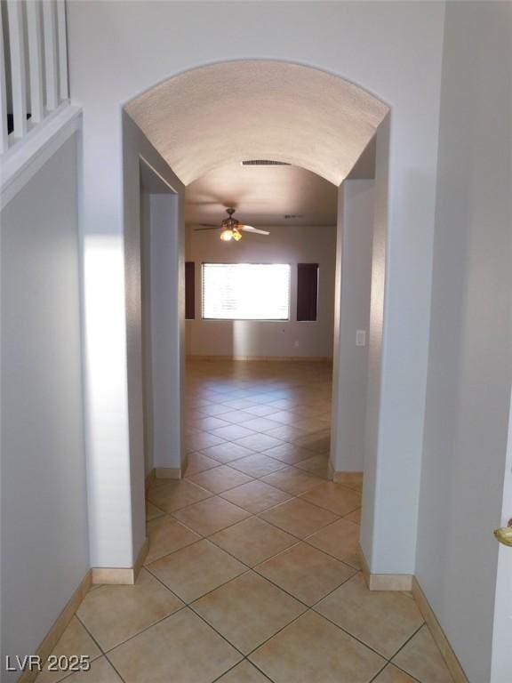2905 Shimmering Bay St, Laughlin, NV 89029 - hall with arched walkways, light tile patterned floors, and baseboards