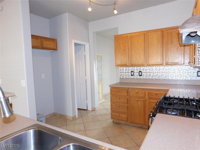 2905 Shimmering Bay St, Laughlin, NV 89029 - kitchen featuring tasteful backsplash, island exhaust hood, light countertops, range with gas cooktop, and light tile patterned flooring