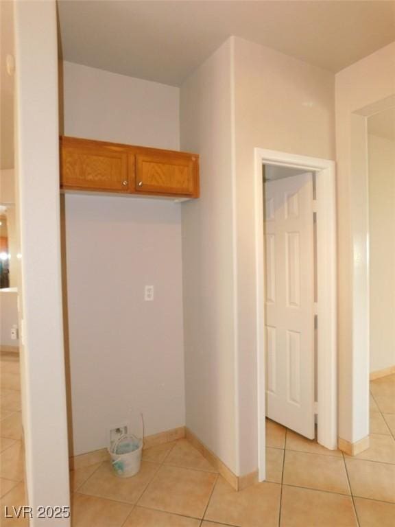 2905 Shimmering Bay St, Laughlin, NV 89029 - laundry area with light tile patterned flooring and baseboards