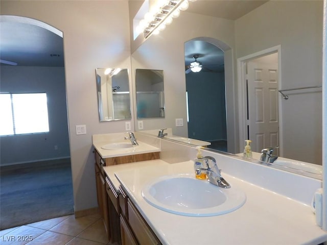2905 Shimmering Bay St, Laughlin, NV 89029 - bathroom featuring tile patterned floors, double vanity, a ceiling fan, and baseboards