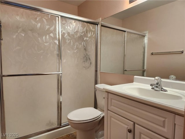 2106 Pebble Creek Ln, Laughlin, NV 89029 - bathroom featuring toilet, a shower with shower door, and vanity