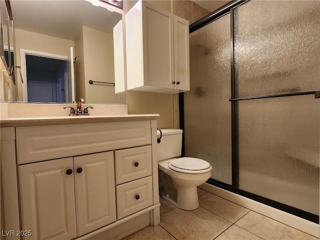 2106 Pebble Creek Ln, Laughlin, NV 89029 - full bathroom with tile patterned floors, a shower stall, vanity, and toilet
