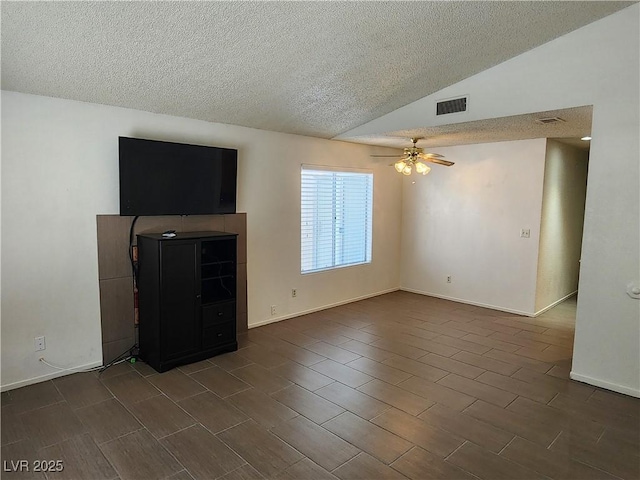 2106 Pebble Creek Ln, Laughlin, NV 89029 - unfurnished living room with a textured ceiling, a ceiling fan, vaulted ceiling, dark wood-type flooring, and baseboards