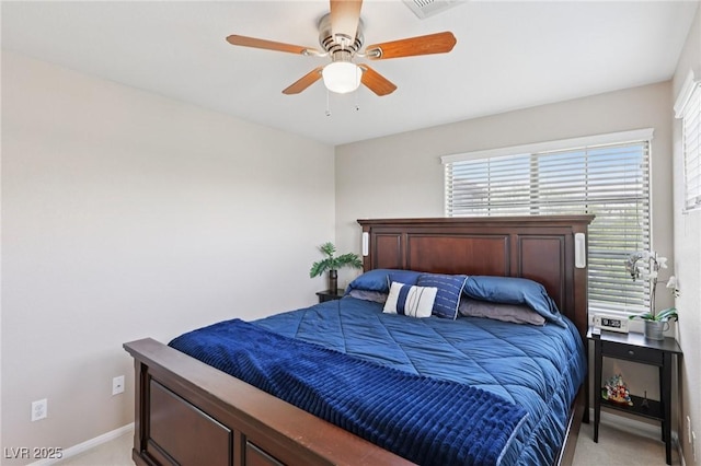 10329 Walworth Ave, Las Vegas, NV 89166 - bedroom featuring light carpet, baseboards, and a ceiling fan