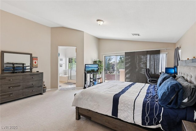 10329 Walworth Ave, Las Vegas, NV 89166 - carpeted bedroom featuring vaulted ceiling, access to exterior, and ensuite bath