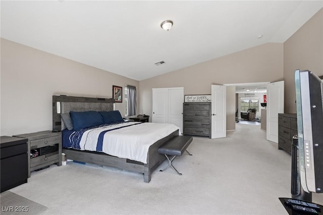 10329 Walworth Ave, Las Vegas, NV 89166 - bedroom featuring light carpet, vaulted ceiling, and a closet