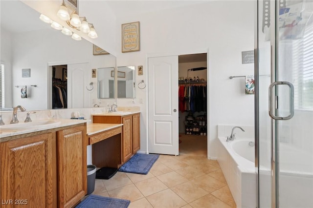 10329 Walworth Ave, Las Vegas, NV 89166 - bathroom featuring double vanity, a spacious closet, tile patterned floors, a garden tub, and a shower stall