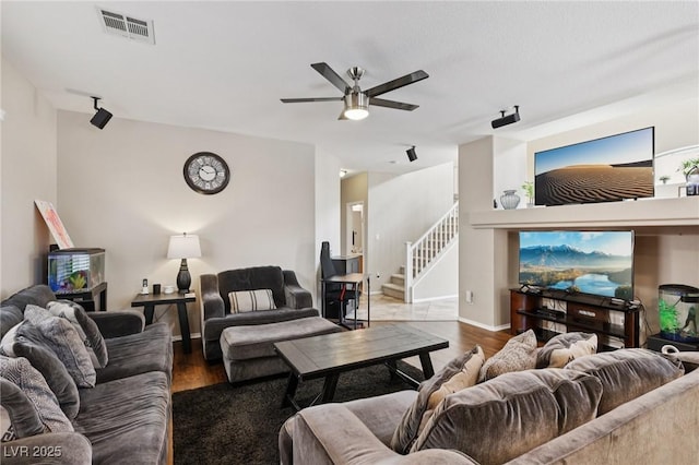 10329 Walworth Ave, Las Vegas, NV 89166 - living room with ceiling fan, wood finished floors, and stairway