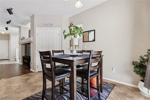 10329 Walworth Ave, Las Vegas, NV 89166 - dining space with light tile patterned floors and baseboards